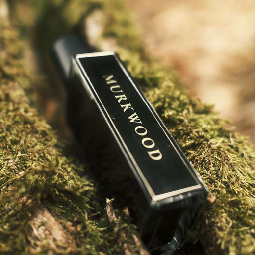 A Pineward bottle labelled Murkwood, lying on moss